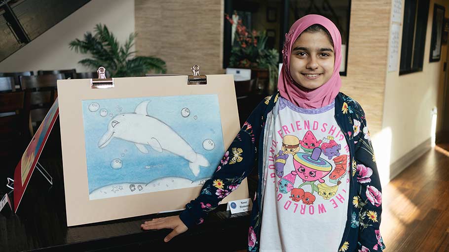 Jamboree resident showcasing her artwork
