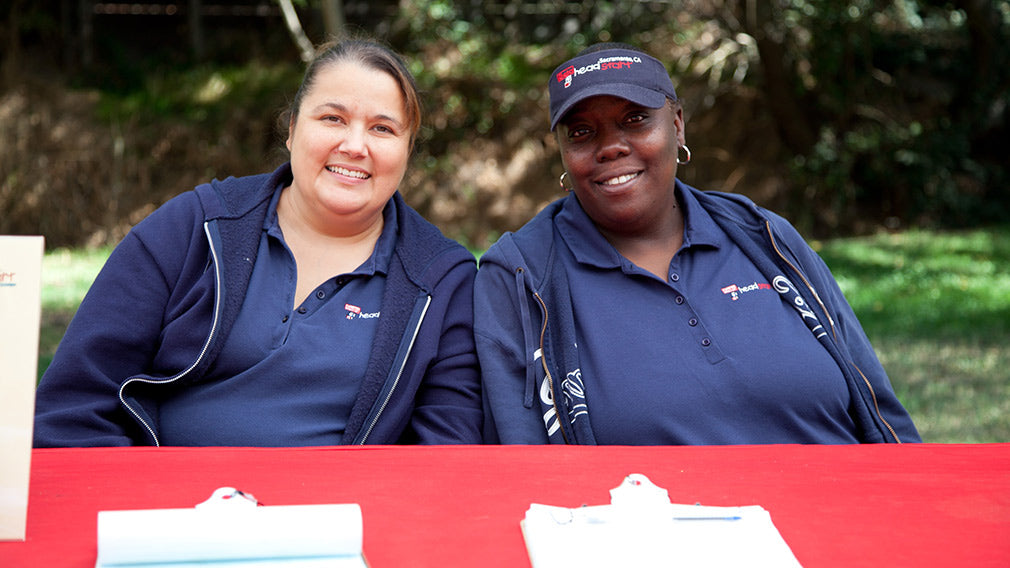 Jamboree volunteers at event registration table 
